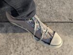 A pair of Chuck Taylor All Star high top converse in a state of disrepair